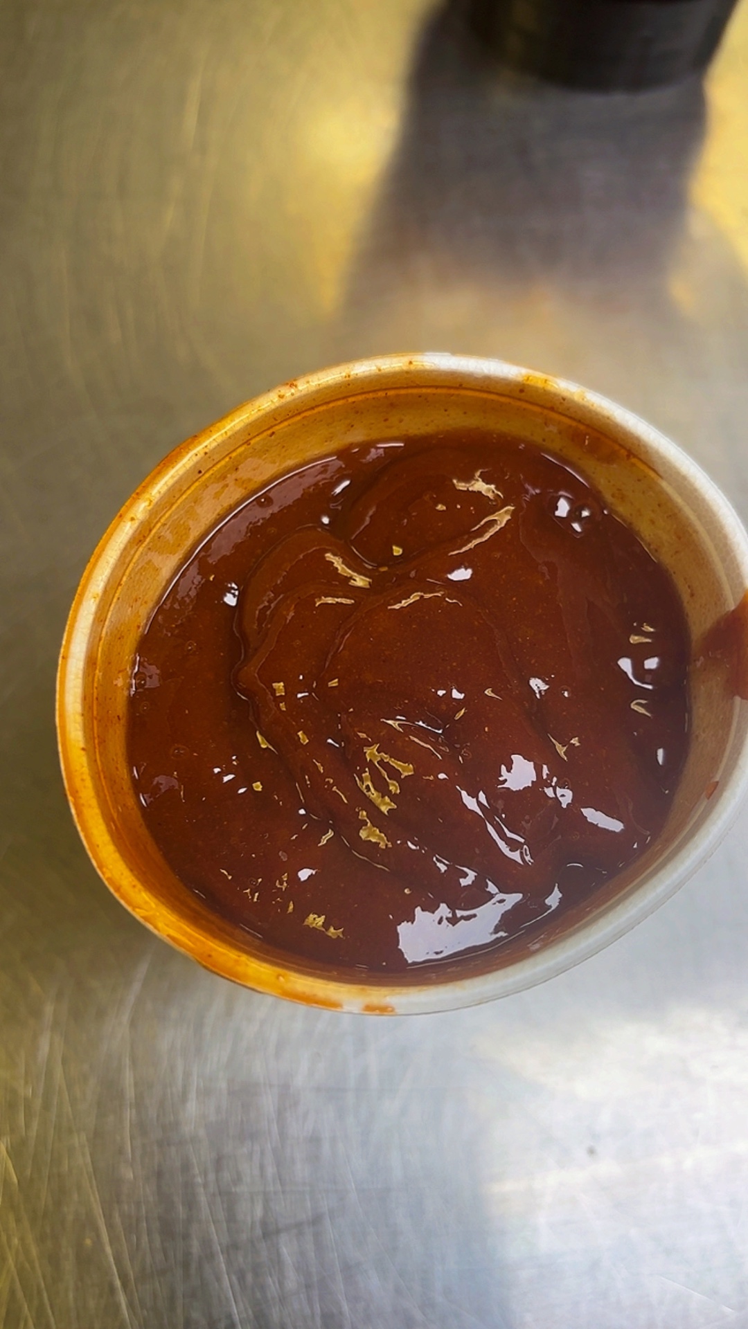 Island Drip, the rich dark sauce in a cup